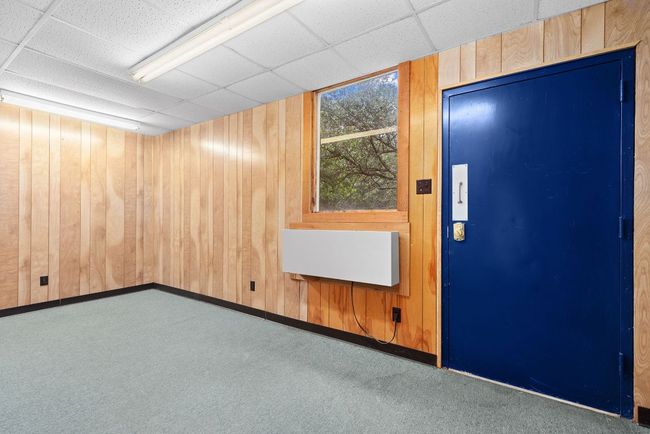 Enclosed garage office with wall unit | Image 27
