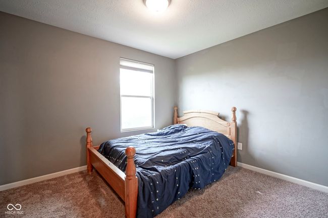 bedroom with carpet and baseboards | Image 25