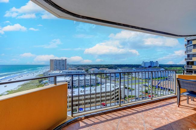 Balcony with a view of the beach and a water view | Image 16