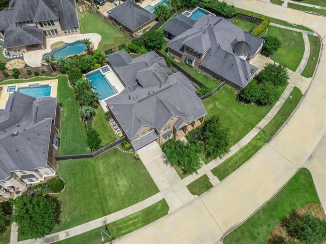 A massive lot on the curve of the street which creates tons on separation between neighbors and beautiful curb appeal! | Image 4