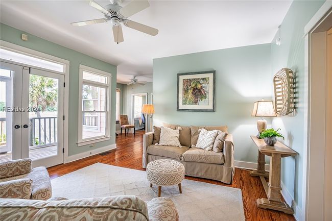Living room featuring french doors, hardwood / wood-style flooring, and ceiling fan | Image 10