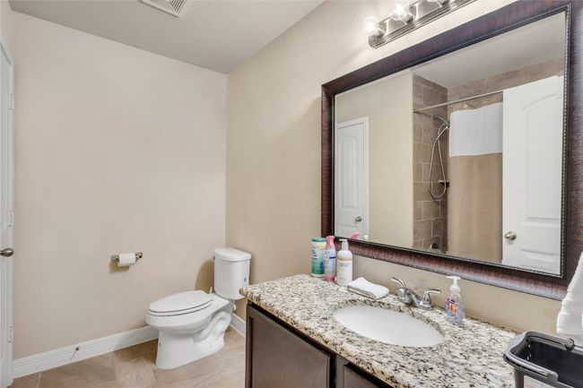 Workout room with a ceiling fan and carpet flooring | Image 12