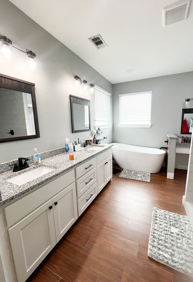 Bathroom with vanity, hardwood / wood-style floors, and a washtub | Image 12