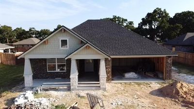 Craftsman-style home with a single door 2 car garage | Image 1