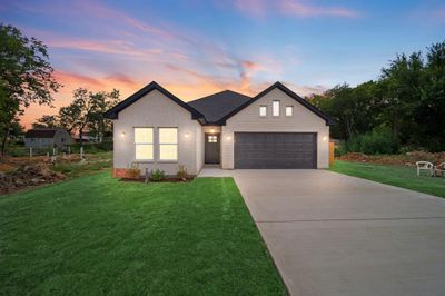 View of front of property with a garage and a yard | Image 2