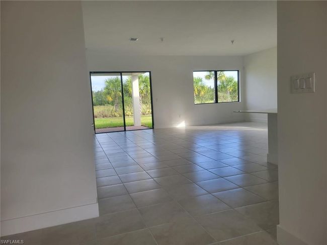Tiled spare room with baseboards | Image 28