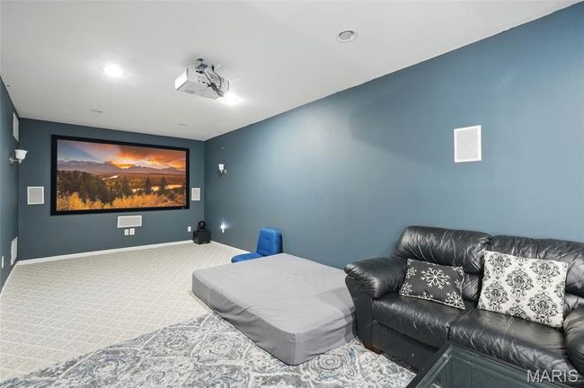 Carpeted home theater room with baseboards and recessed lighting | Image 26