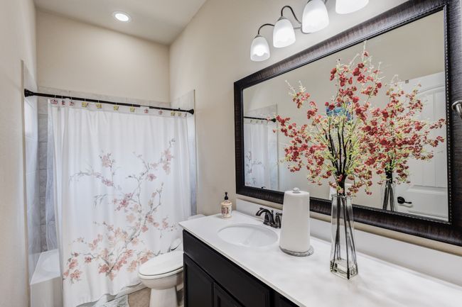 Full bath featuring vanity, toilet, shower / bath combination with curtain, and recessed lighting | Image 22
