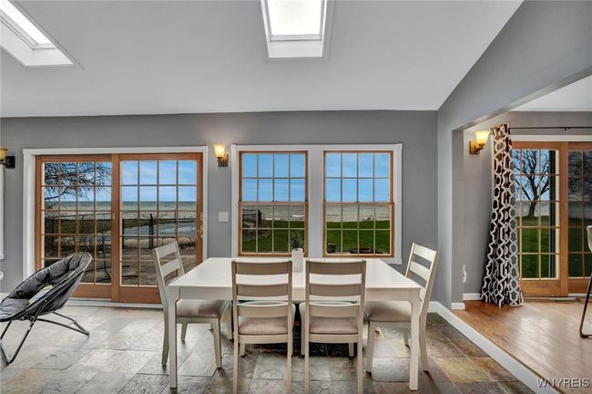 Large open area along rear of home perfect for dining area or extended living area, the possibilities are endless! | Image 18