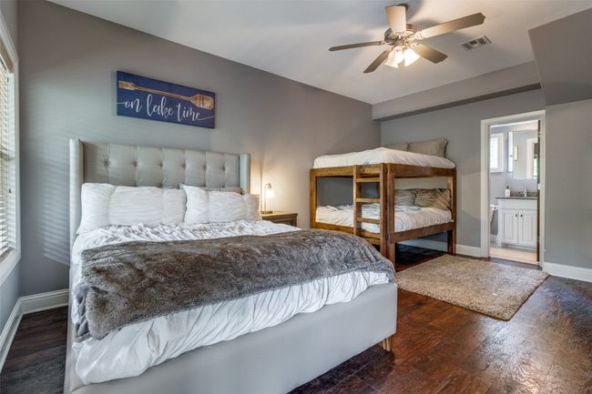Bedroom with ceiling fan, ensuite bath, and hardwood / wood-style flooring | Image 19