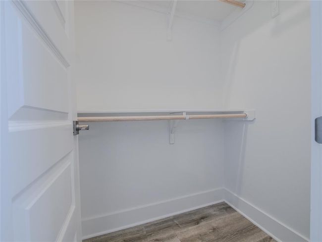 Spacious closet featuring wood finished floors | Image 31