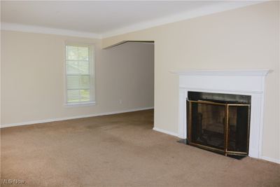 Unfurnished living room featuring carpet floors | Image 3