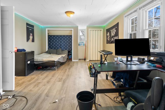bedroom featuring wood finished floors and ornamental molding | Image 9