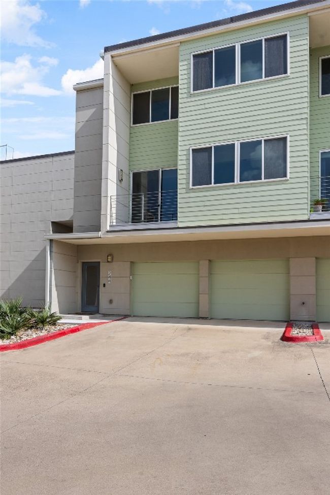 View of front facade with a garage and concrete driveway | Image 24