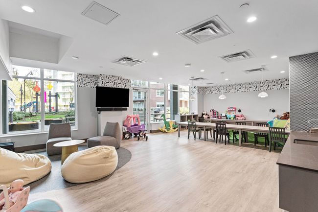 Rec room featuring a wealth of natural light, light wood-type flooring, and recessed lighting | Image 33