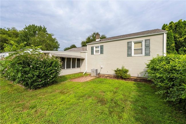 Back of house with screened in room | Image 26