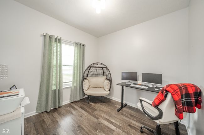 office space with dark wood-type flooring and baseboards | Image 12