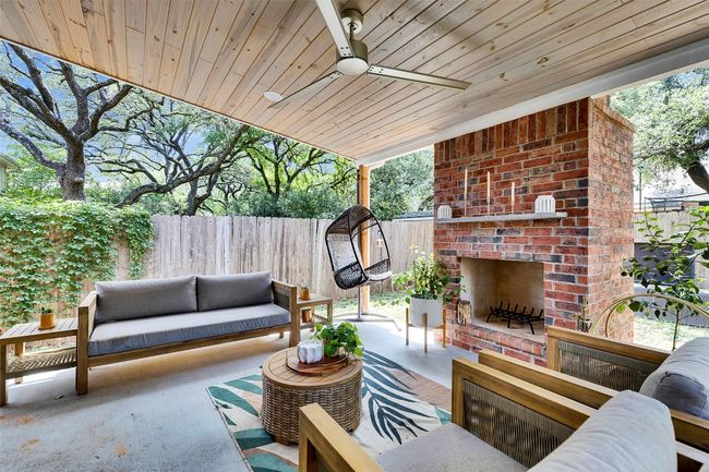 View of patio with an outdoor living space with a fireplace and ceiling fan | Image 30