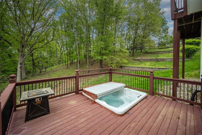 Deck with a covered hot tub | Image 54
