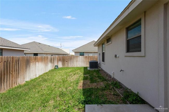 View of fenced backyard | Image 20
