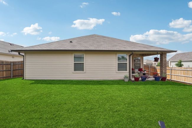 Back of property with a fenced backyard and roof with shingles | Image 33