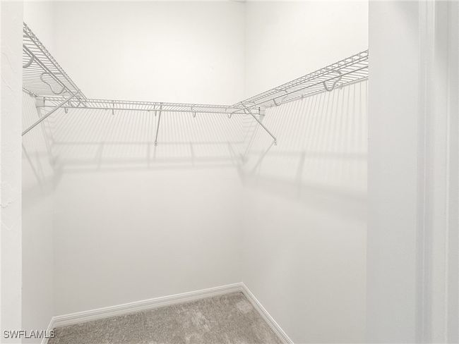 Spacious closet with carpet | Image 29