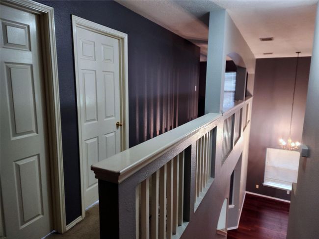 Upstairs Hallway leads to the Study and Secondary Bedrooms | Image 9