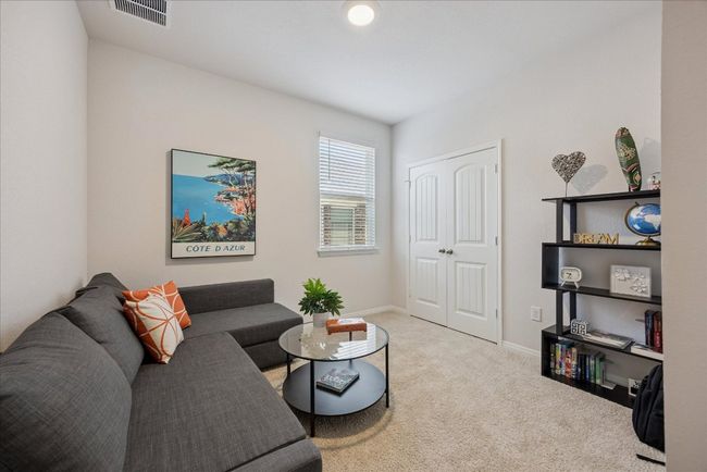 Carpeted living area featuring baseboards | Image 30