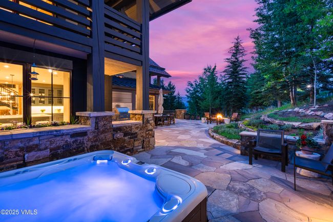Saltwater Hot Tub Set Against a Lush Multi-Tiered Rock Landscape. | Image 12