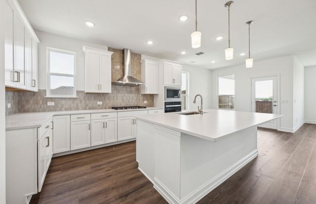 Bright kitchen with an expansive center island perfect for gatherings *Real home pictured | Image 5