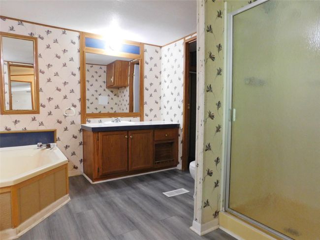 En suite bathroom with separate shower | Image 8