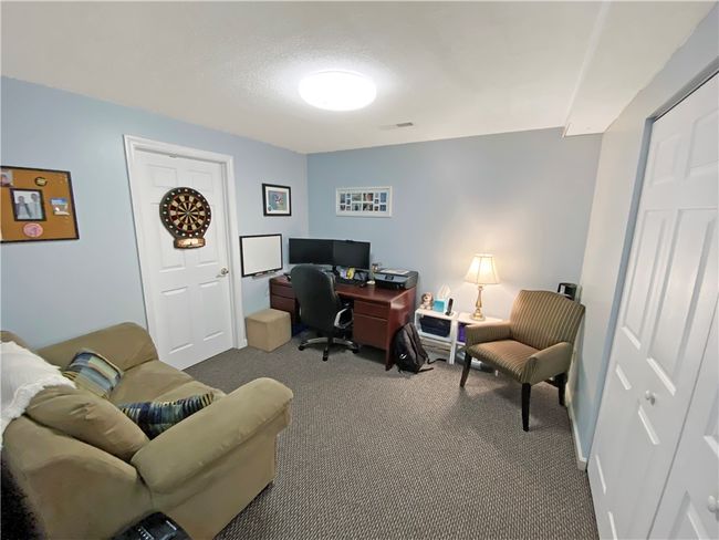 Finished game room on the lower level. | Image 21