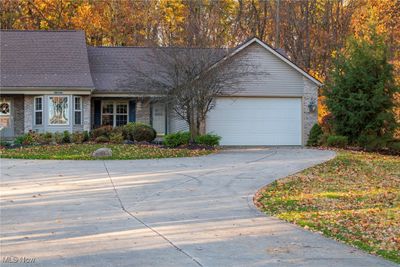 Ranch-style house with a garage | Image 1