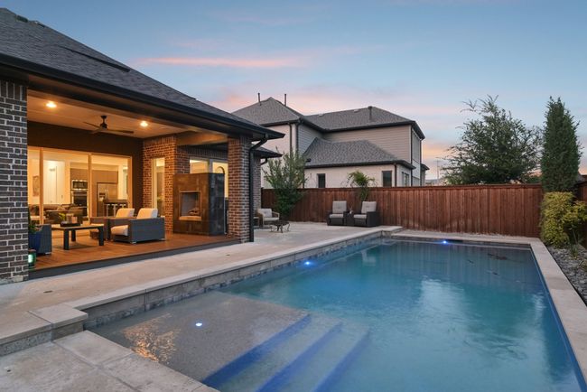 View of swimming pool with a fenced backyard, ceiling fan, a patio, and an outdoor living space | Image 31