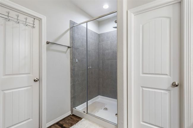 Primary bathroom has a nicely tiled shower. | Image 26