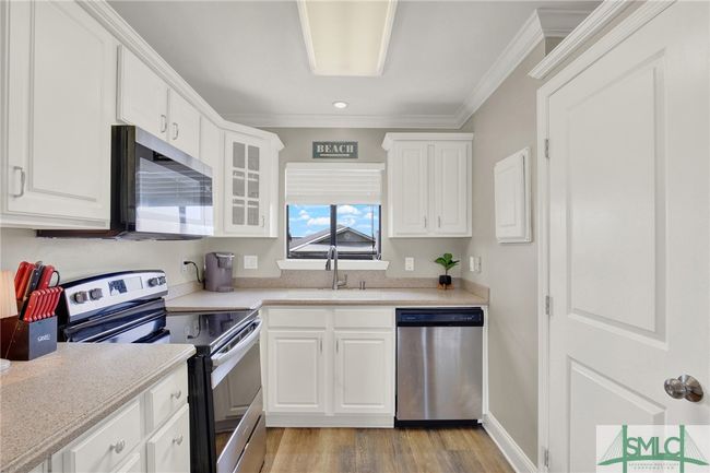 Updated Kitchen with Stainless Steel Appliances & Breakfast Bar | Image 11