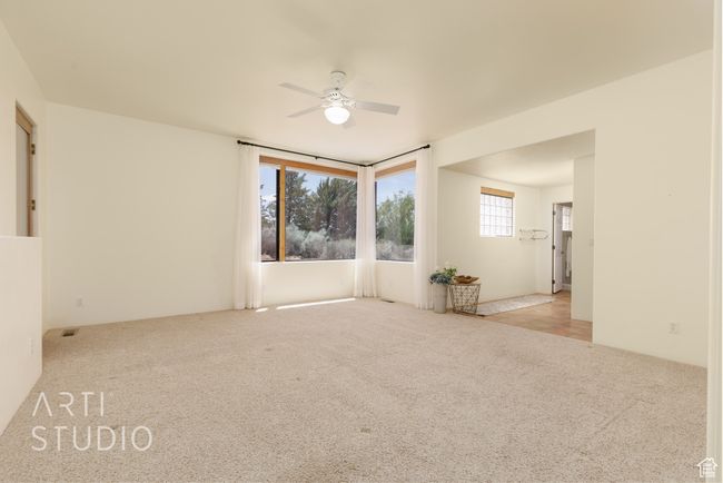 Unfurnished room featuring a ceiling fan and carpet | Image 25