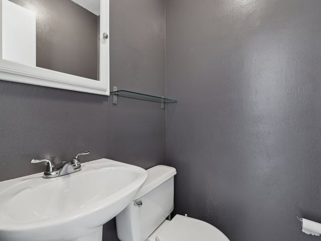 Half bath with a sink and toilet | Image 15