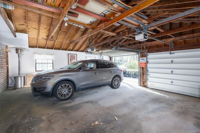 Garage with a garage door opener | Image 34