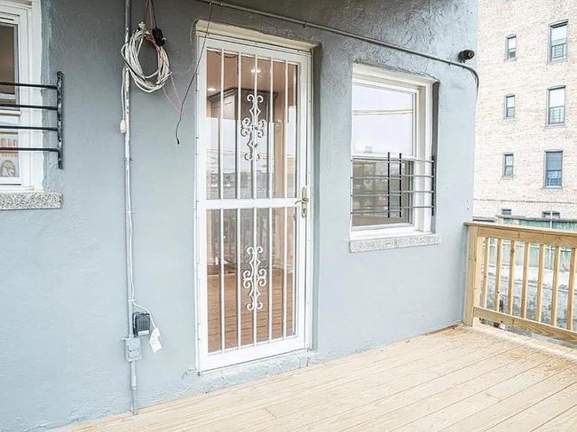 View of exterior entry with stucco siding | Image 15