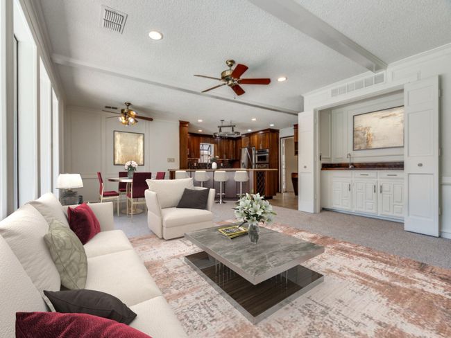 Massive family room is open to the kitchen and has a wet bar. | Image 10