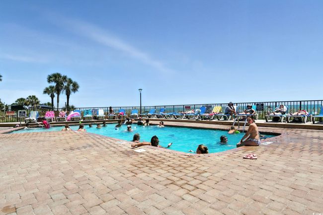 Community pool with a patio | Image 28