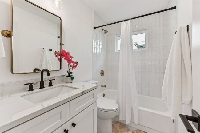 Step into luxury—an oversized walk-in shower with modern tile and glass enclosure. | Image 19