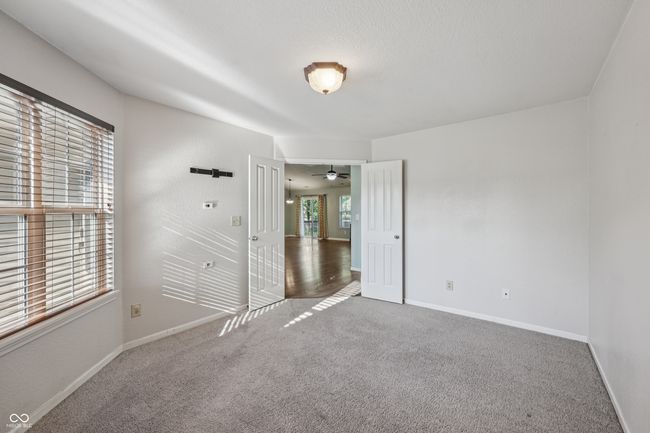 unfurnished bedroom with carpet | Image 18