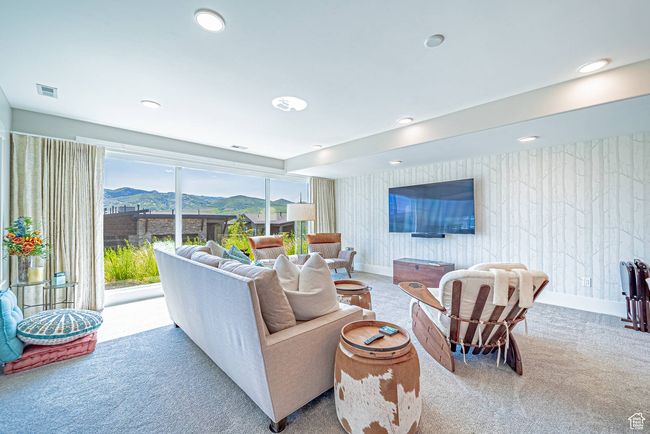 Carpeted living area featuring recessed lighting and baseboards | Image 15