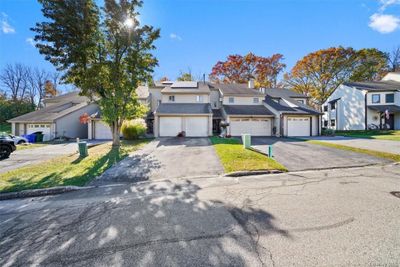 View of front facade with a garage | Image 1