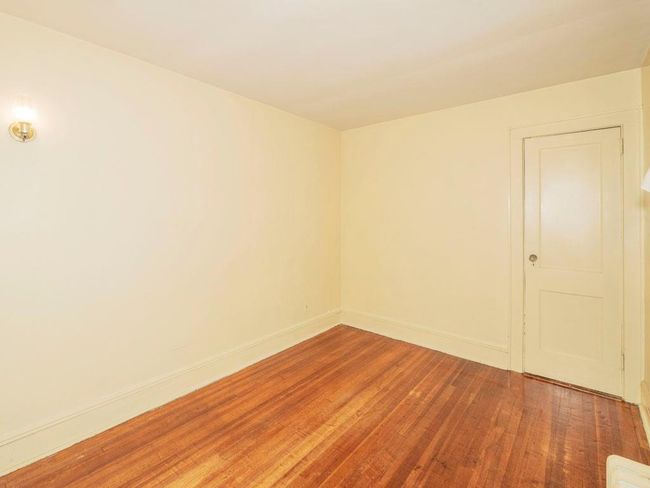 Unfurnished room with wood finished floors and baseboards | Image 26