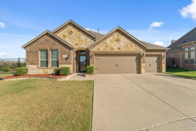 View of front of house with a garage and a front lawn | Image 1