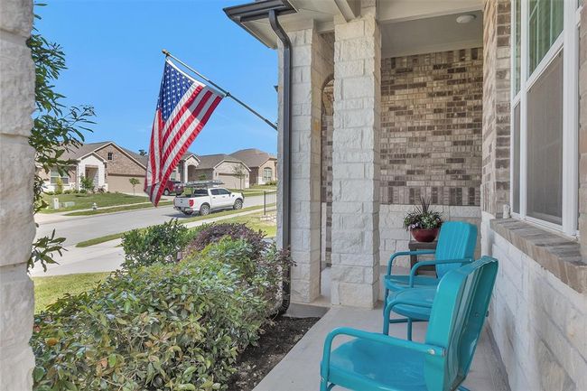 You are welcomed by a cozy covered front porch. | Image 5