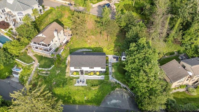 Aerial overview of property's location with nearby suburban area | Image 43